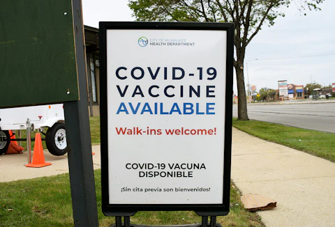 vaccine sign outside Milwaukee mill road library