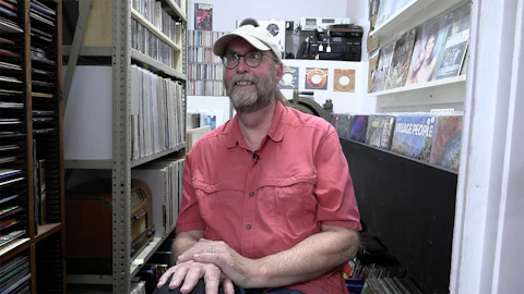 Steve Cotherman is the manager of the Washburn Cultural Center and proud curator of the Vinyl Vault. He is happy to send anyone home with a stack of classics. (Photo by JT Cestkowski)