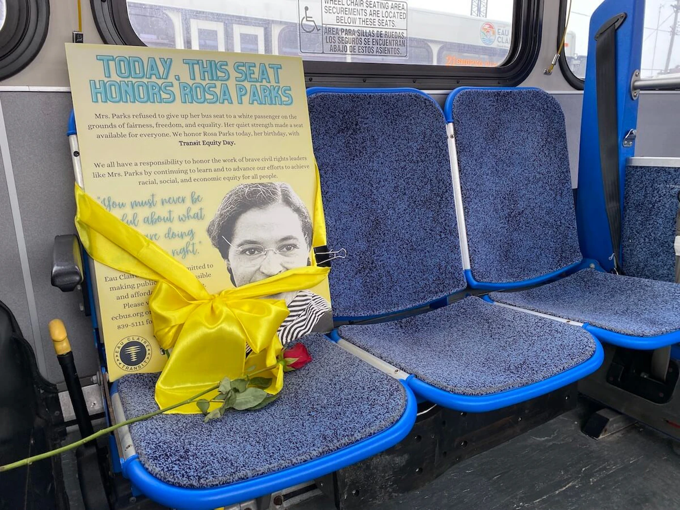 An Eau Claire bus seat "reserved" for Rosa Parks in honor of Transit Equity Day. (Photo by Julian Emerson)