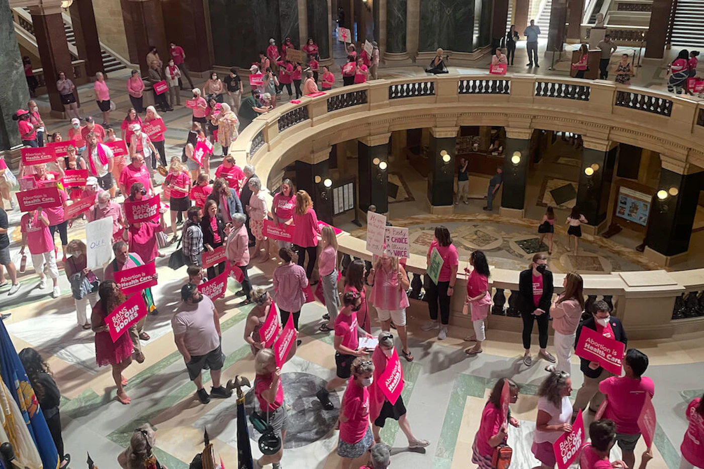 Abortion rights supporters gather for a "pink out" protest organized by Planned Parenthood in the rotunda of the state Capitol Wednesday, June 22, 2022, in Madison, Wis. (AP Photo/Harm Venhuizen)