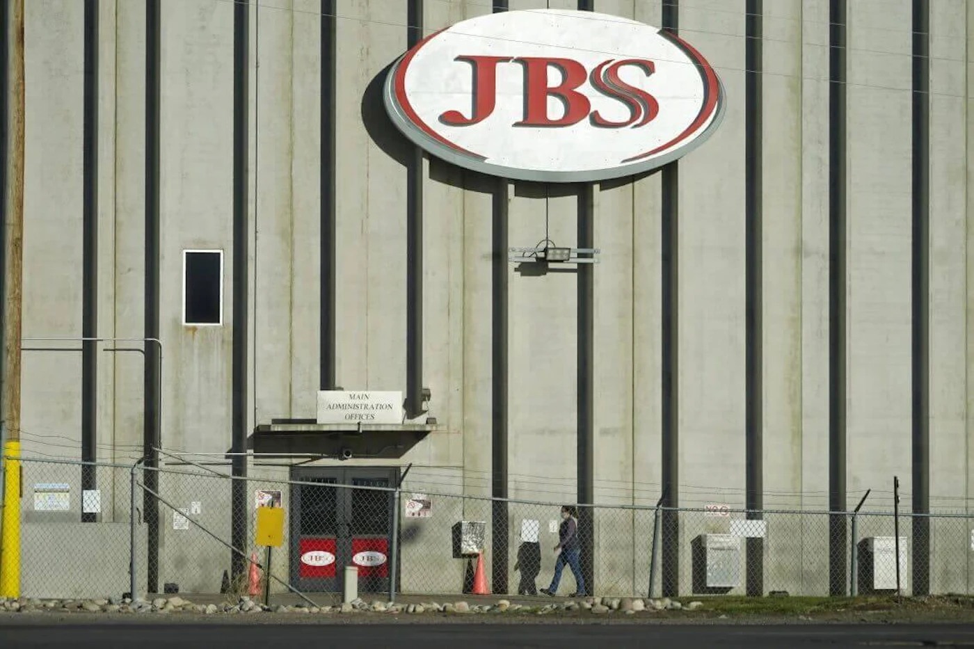 FILE - A worker heads into the JBS meatpacking plant in Greeley, Colo., Oct. 12, 2020. Kids ages 14 and 15 would no longer need a work permit or parental permission to get a job under a bill Wisconsin Republicans released on Friday, Aug. 18, 2023. (AP Photo/David Zalubowski, File)