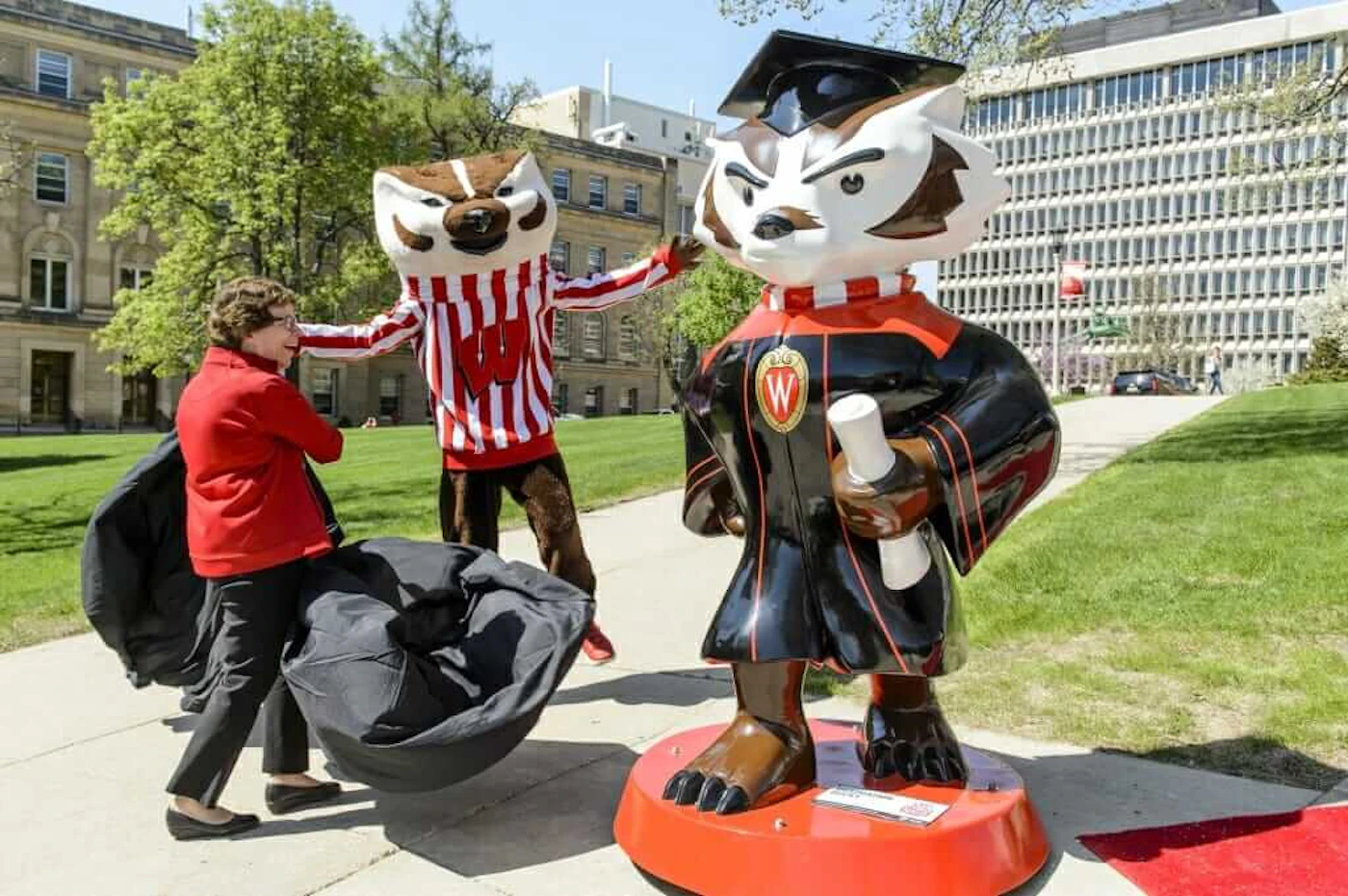 Chancellor Rebecca Black and Bucky pose with the Graduation Bucky statue on Bascom Hill. (Photo via UW-Madison News)