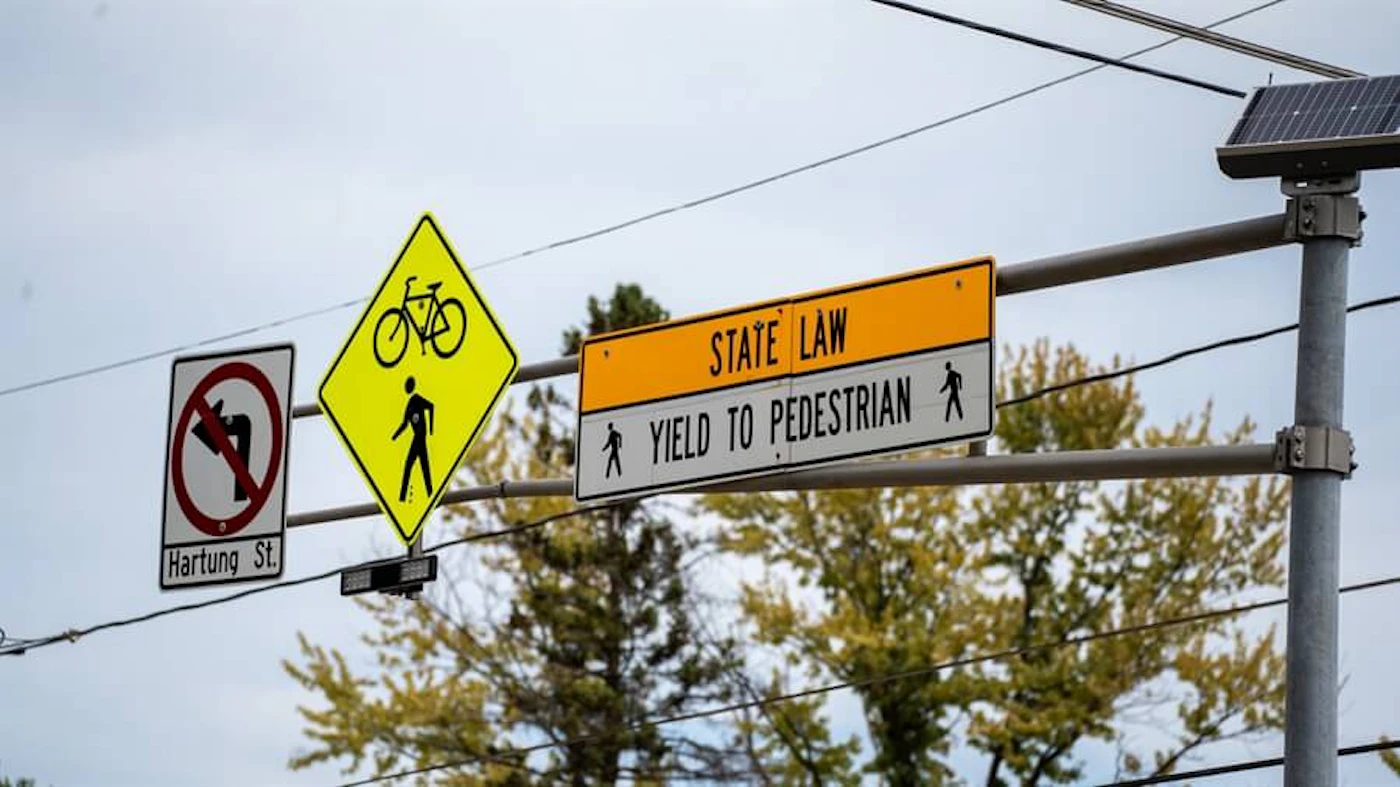 Yielding to pedestrians crossing at crosswalks is Wisconsin law. Photo Courtesy Green Bay Area Public School District