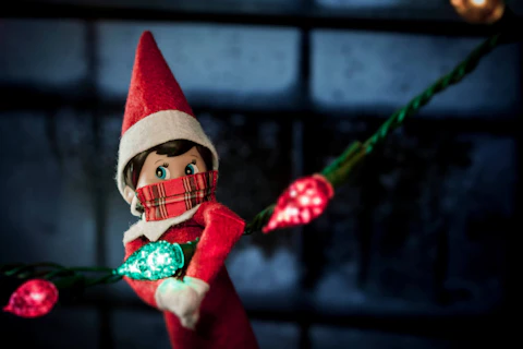 The elf on the shelf wears a mask. (Shutterstock Photo/Willrow Hood)