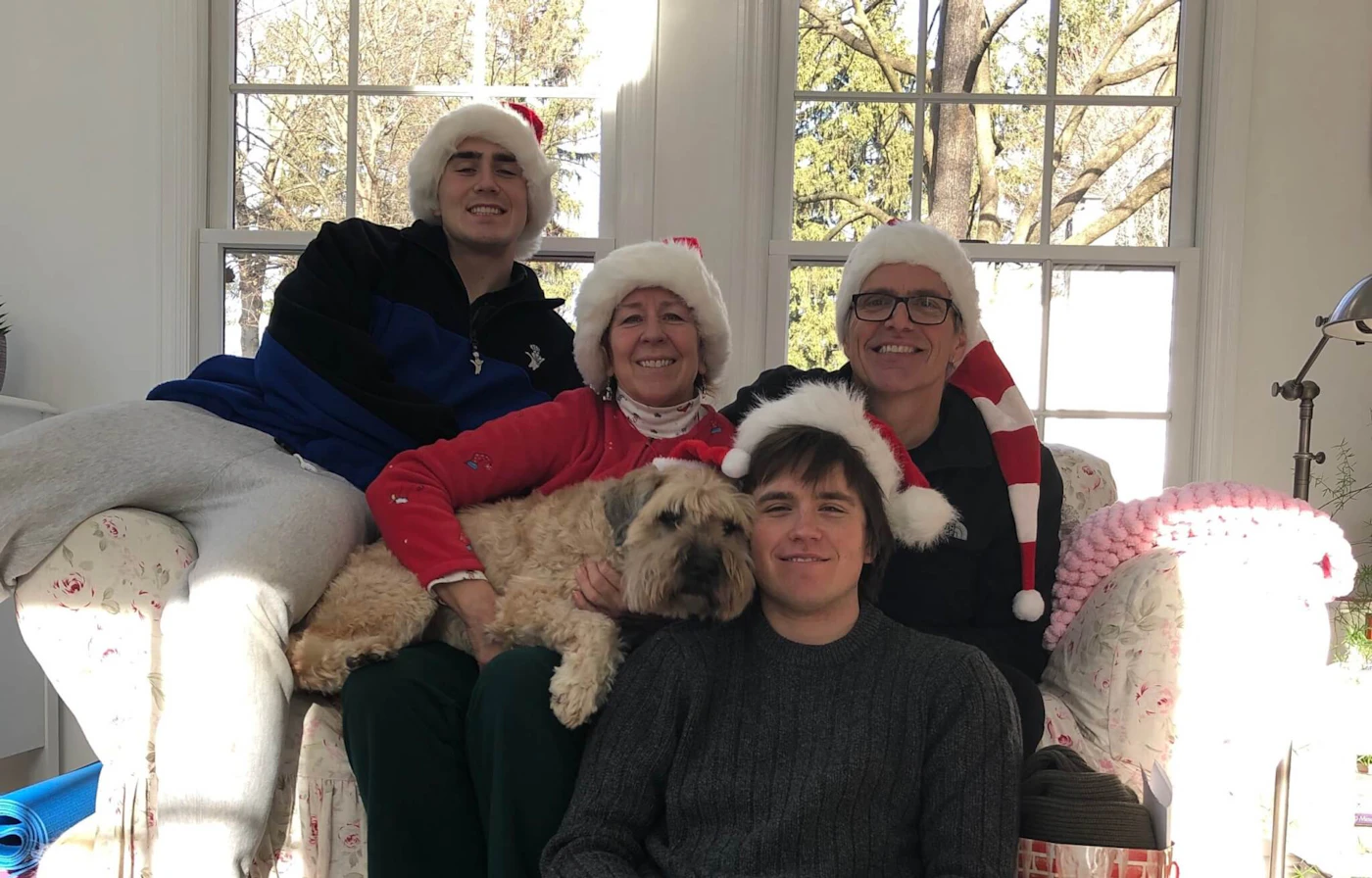 The Moon family, left to right, Gabriel, Joanne, Owen, and Kevin, on Christmas in 2019. Kevin will travel west to spend the holidays with Gabriel and Owen, while Joanne will remain isolated in their Bucks County home. (Courtesy of Joanne Moon)