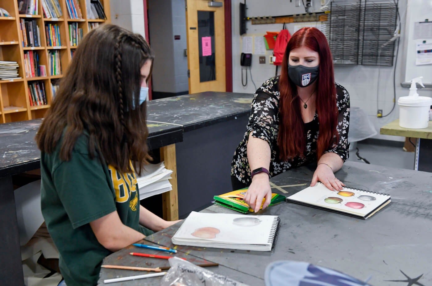 Angelina DeChristopher, a ninth grade student, works with art teacher Jennilee Miller at Brandywine Heights High School in Longswamp Township, March 1, 2021. (Photo by Ben Hasty/MediaNews Group/Reading Eagle via Getty Images)