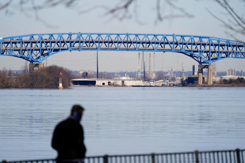 In this Wednesday, Feb. 24, 2021 photo, a person walks past the Girard Point Bridge in Philadelphia. (AP Photo/Matt Rourke, File)