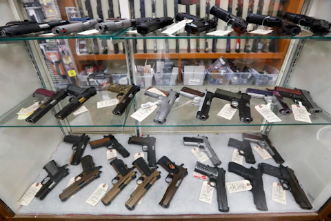FILE - In this March 25, 2020, file photo semi-automatic handguns are displayed at shop in New Castle, Pa. (AP Photo/Keith Srakocic, File)