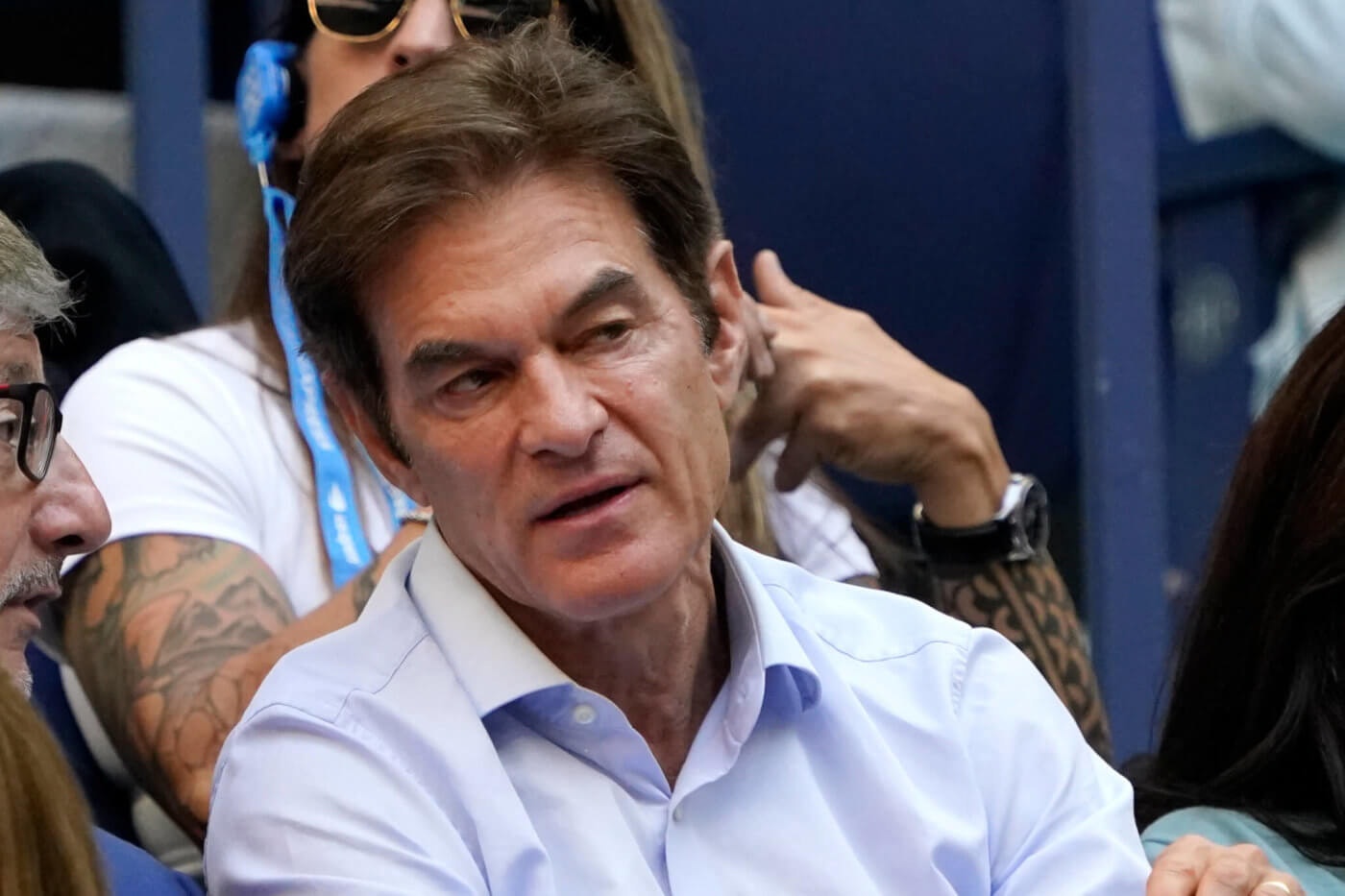 FILE—Dr. Oz watches play during the women's singles final of the US Open tennis championships, in this file photo from Sept. 11, 2021, in New York. Mehmet Oz is running in the wide-open race for the Pennsylvania seat being vacated by two-term Republican Sen. Pat Toomey. The race has attracted wealthy and well-connected transplants, and homers.(AP Photo/Elise Amendola, File)