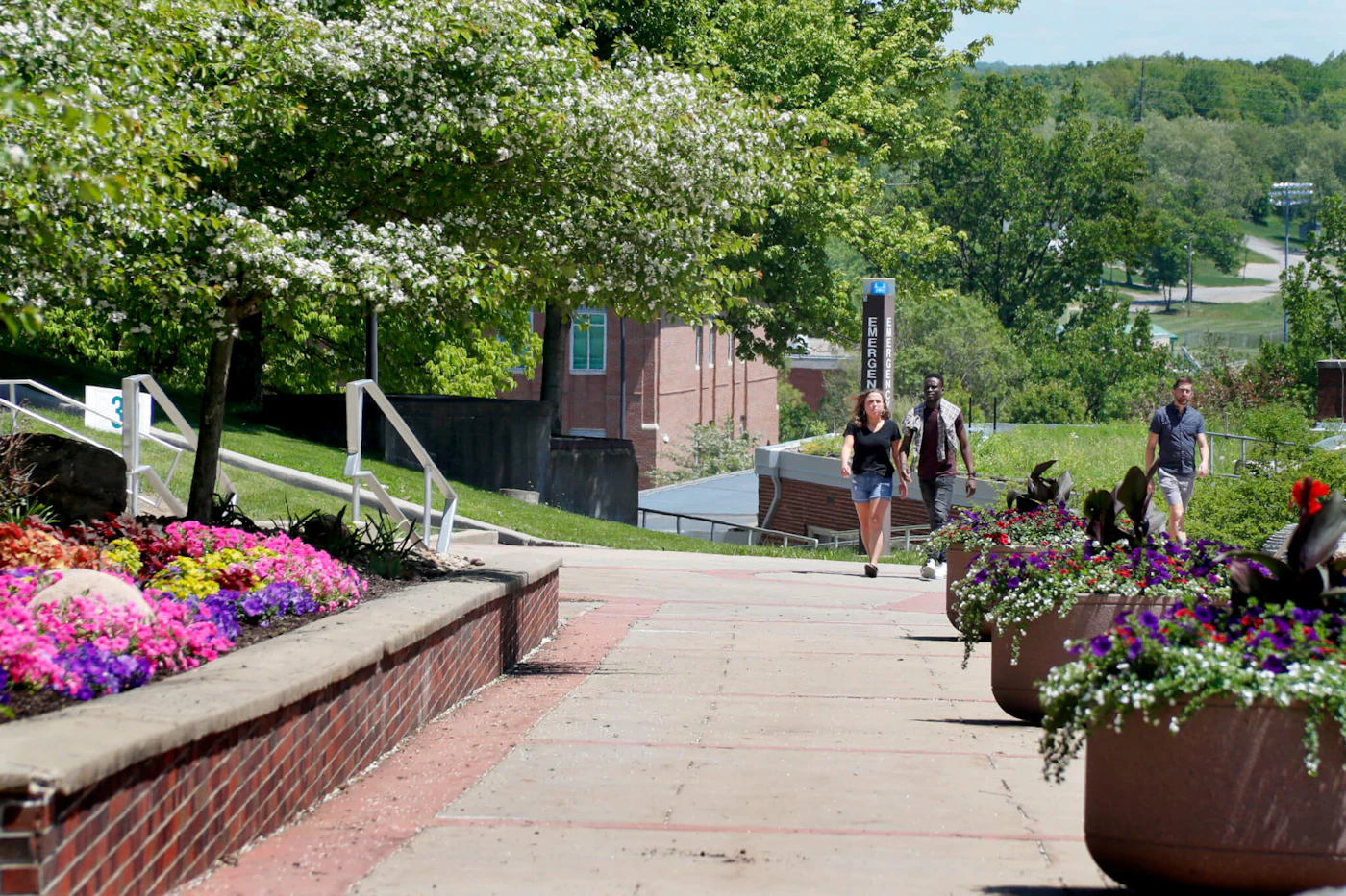 Visitors walk through the campus of Slippery Rock University in Slippery Rock, Butler County, in May 2019. (AP File Photo/Keith Srakocic)