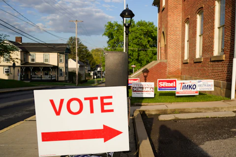 Signs point the way for voters to cast their ballots at the polling location for the Pennsylvania primary election, Tuesday, May 17, 2022, in Harmony, Pa., (AP Photo/Keith Srakocic)