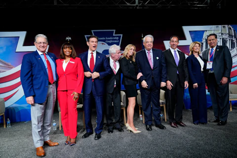 FILE—In this file photo from April 2, 2022, George Bochetto, Kathy Barnette, Mehmet Oz, Jeffrey Lord, Rose Tennent, John Gizzie, Jeff Bartos, Carla Sands, and Lowman Henry pose for a photograph during a forum for Republican candidates for U.S. Senate in Pennsylvania at the Pennsylvania Leadership Conference in Camp Hill, Pa. Republicans have made anger over the 2020 election a staple of this year's mid-term primary campaigns as Democrats appear prepared to tie them to the Jan. 6 insurrection at the U.S. Capitol, contending that Republican-sponsored election legislation is an attack on voting rights. Pennsylvania's primary election is May 17. (AP Photo/Matt Rourke, File)