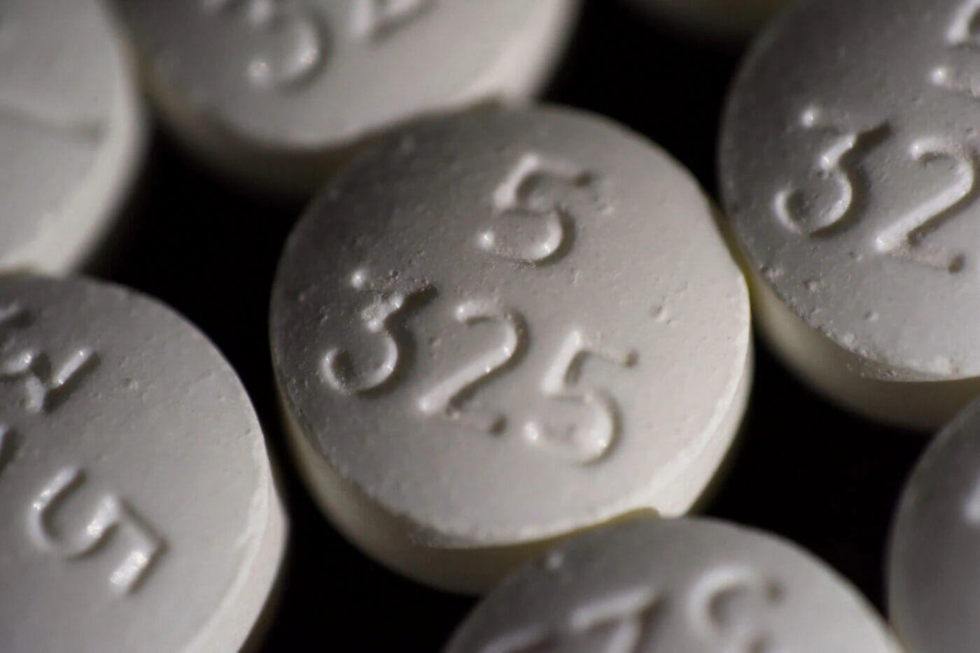 FILE - An arrangement of pills of the opioid oxycodone-acetaminophen in New York. Idaho officials on Friday, May 13, 2022, agreed to a $119 million settlement with drugmaker Johnson & Johnson and three major distributors over their role in the opioid addiction crisis. (AP Photo/Patrick Sison, File)
