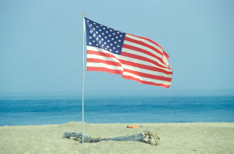 American Flag on the Beach of Lake Erie, Pennsylvania (Photo by: Joe Sohm/Visions of America/Universal Images Group via Getty Images)