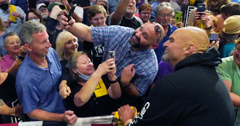 Pennsylvania Lt. Gov. John Fetterman, the Democratic nominee for the state's U.S. Senate seat, right, poses for a photo with a supporter after speaking at a rally in Erie, Pa., on Friday, Aug. 12, 2022. (AP Photo/Gene J. Puskar)