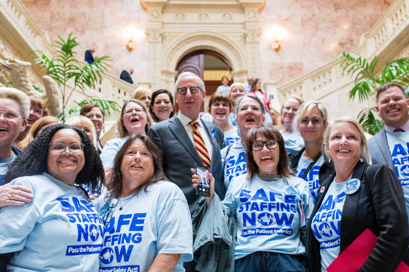 Pennsylvania nurses celebrate with House Health Committee Chairman Dan Frankel (D-Allegheny) at the State Capitol in Harrisburg, Tuesday, June 7, 2023, after the committee passed the Patient Safety Act. (Photo: Sean Kitchen)