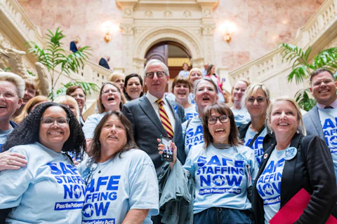 Pennsylvania nurses celebrate with House Health Committee Chairman Dan Frankel (D-Allegheny) at the State Capitol in Harrisburg, Tuesday, June 7, 2023, after the committee passed the Patient Safety Act. (Photo: Sean Kitchen)