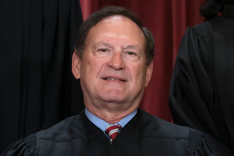 FILE - Associate Justice Samuel Alito joins other members of the Supreme Court as they pose for a new group portrait, at the Supreme Court building in Washington, Friday, Oct. 7, 2022. Alito writing in the Supreme Court's opinion,"Roe was egregiously wrong from the start," that overturned Roe v. Wade made the top three of a Yale Law School librarian's list of the most notable quotations of 2022. (AP Photo/J. Scott Applewhite, File)