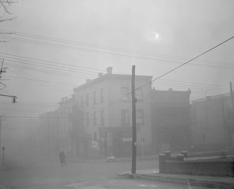 FILE - In this Oct. 30, 1948, photo the main business district of Donora, Pa., is is cloaked in smog, the sunlight virtually obliterated by thick low hanging pollution. From 1969 to 1980, Congress passed a wide range of environmental bills tackling air and water pollution, garbage, protections for fisheries and marine mammals, and endangered species; in 1990 Congress tackled acid rain by rehauling the Clean Air Act. Now in the week of April 20, 2009, lawmakers begin hearings on an energy and global warming bill that could revolutionize how the country produces and uses energy, and could for the first time reduce the pollution responsible for heating up the planet. (AP Photo/Walter Stein, FILE)