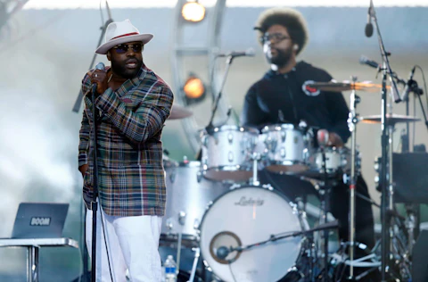 FILE - In this July 4, 2014 file photo, Tariq "Black Thought" Trotter, left, and Ahmir "Questlove" Thompson of The Roots, perform during an Independence Day celebration in Philadelphia. The Roots are tapping into their resources to help raise funds for their high-school alma mater in Philadelphia. The Grammy-winning hip-hop band created the CAPA Foundation after learning that $1.1 million had been cut from the budget of the Philadelphia High School for Creative and Performing Arts. (AP Photo/Matt Rourke, File)