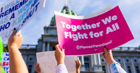 Reproductive Rights supporter holding a Planned Parenthood sign in front of the Pennsylvania Capitol on Oct. 2, 2021. (Photo: Sean Kitchen)