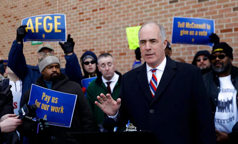 U.S. Sen. Bob Casey, D-Pa., speaks at a rally by federal workers at the Philadelphia International Airport to end the government shutdown, Friday, Jan. 25, 2019, in Philadelphia. (AP Photo/Matt Slocum)