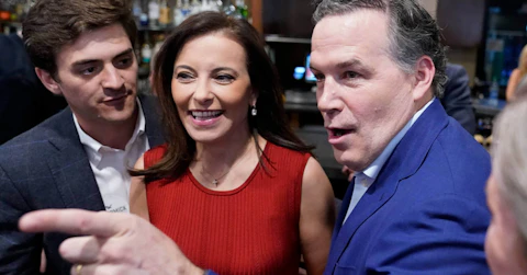 Republican candidate for U.S. Senate in Pennsylvania, Dave McCormick and his wife Dina Powell greet supporters as he arrives for his returns watch party in the Pennsylvania primary election, Tuesday, May 17, 2022, in Pittsburgh. (AP Photo/Keith Srakocic)