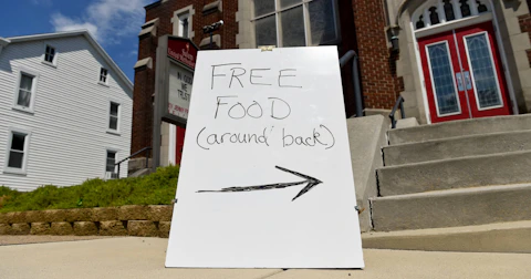 A sign outside the church that reads "Free Food (around back)." During a food distribution at the Salem United Methodist Church in Shoemakersville, PA Wednesday afternoon July 15, 2020. (Photo by Ben Hasty/MediaNews Group/Reading Eagle via Getty Images)