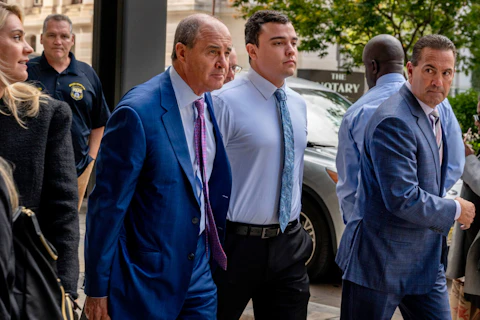 FILE - Philadelphia police Officer Mark Dial, center, arrives at the Juanita Kidd Stout Center for Criminal Justice in Philadelphia, Sept. 19, 2023, with attorneys Brian McMonagle, left and Fortunato Perri, right, for a bail hearing. Lawyers for Dial, who shot and killed a driver, will press to have the murder charges lodged against him dismissed when the jailed officer appears in court, Tuesday, Sept. 26. (Tom Gralish/The Philadelphia Inquirer via AP, File)