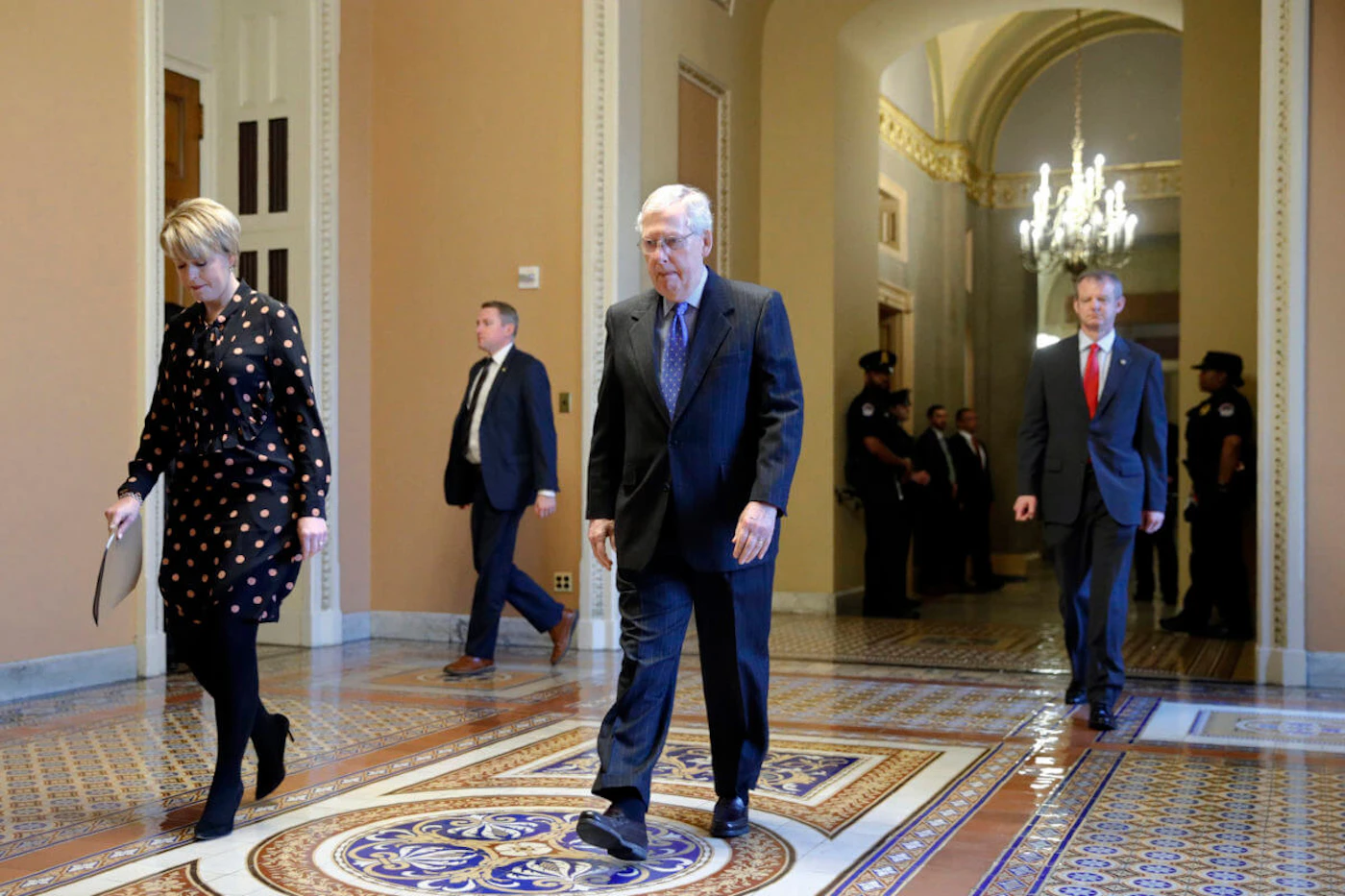 Senate Majority Leader Mitch McConnell of Ky. walks to the Senate chamber on Capitol Hill in Washington, Tuesday, March 24, 2020. (AP Photo/Patrick Semansky)