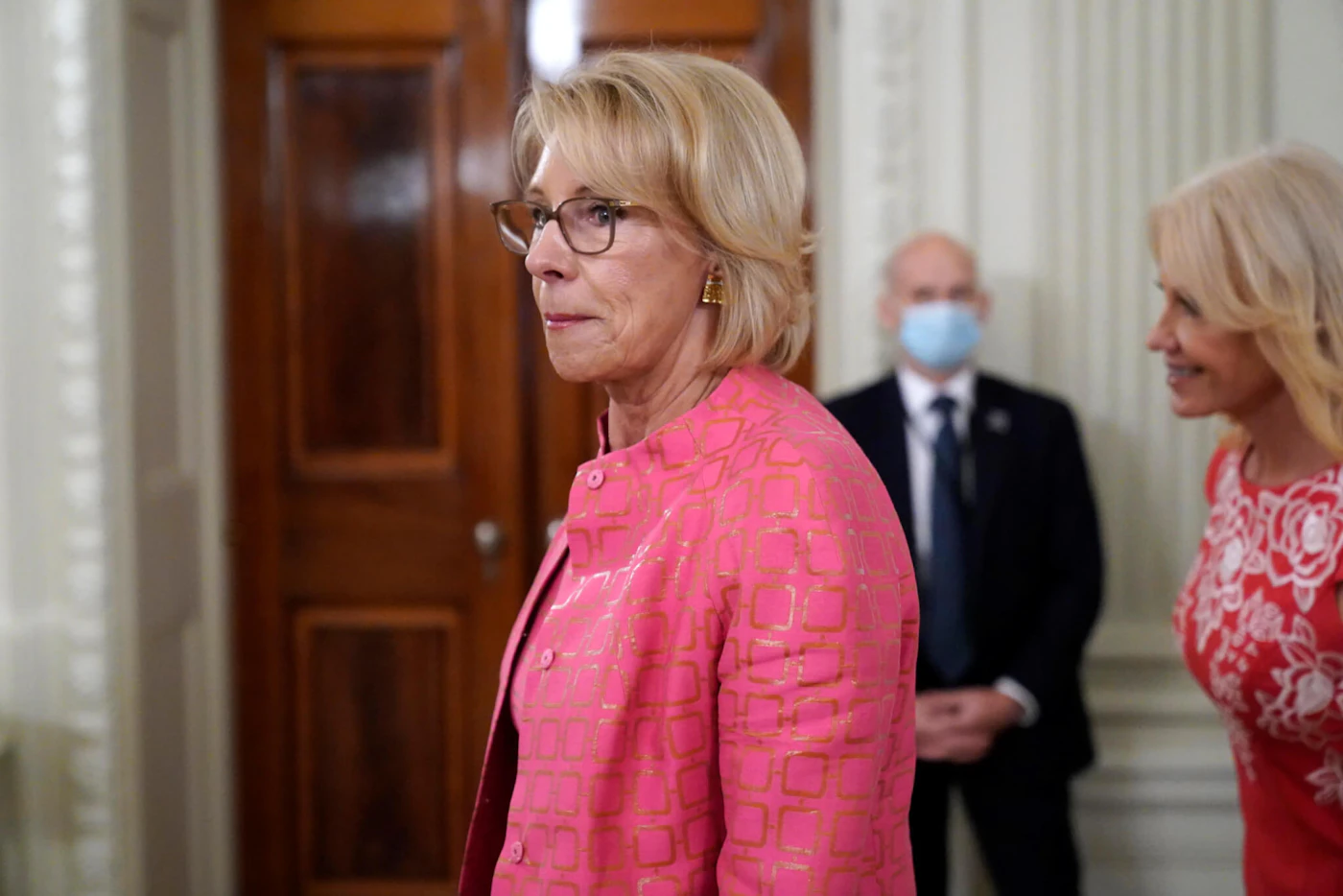 Education Secretary Betsy DeVos arrives for an event called "Kids First: Getting America's Children Safely Back to School" in the State Dining room of the White House, Wednesday, Aug. 12, 2020, in Washington. (AP Photo/Andrew Harnik)