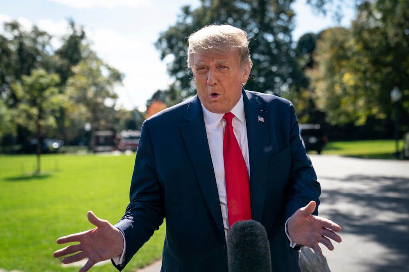 President Donald Trump speaks to reporters on his way to Marine One on the South Lawn of the White House on September 30, 2020 in Washington, DC. President Trump was traveling to Minnesota for a fundraising event and a campaign rally, one day before getting diagnosed with COVID-19. (Photo by Drew Angerer/Getty Images)