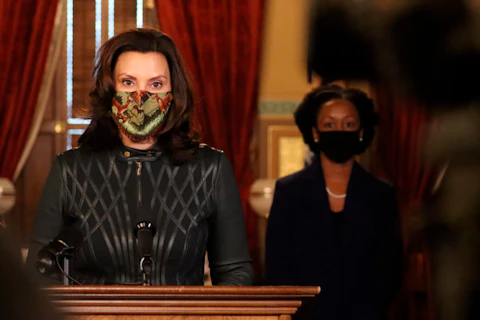 In this photo provided by the Michigan Office of the Governor, Gov. Gretchen Whitmer addresses the state during a speech in Lansing, Mich., Tuesday, Dec. 1, 2020. (Michigan Office of the Governor via AP)