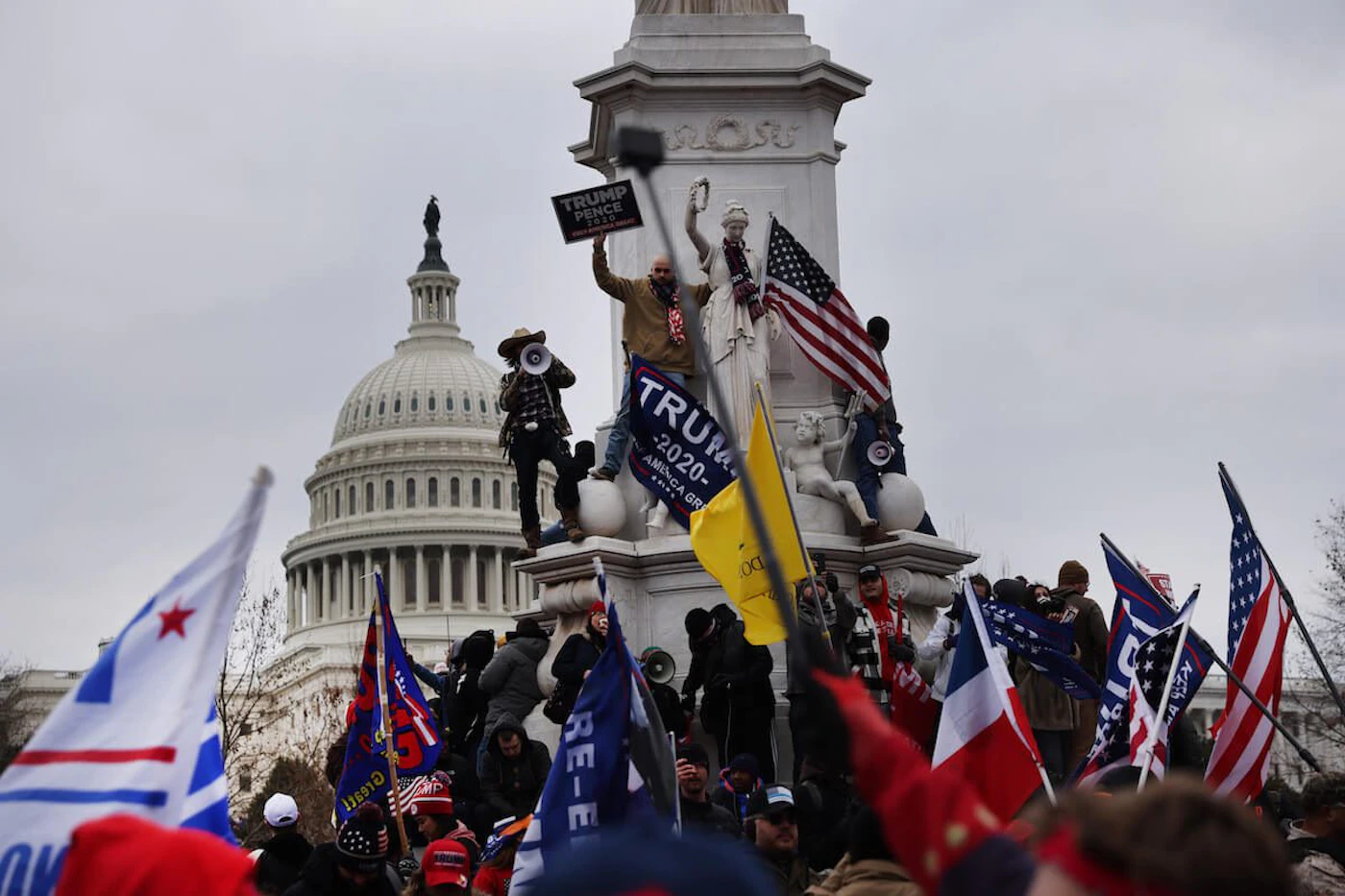 Supporters of President Donald Trump surround the U.S. Capitol following a rally on January 6, 2021 in Washington, DC. Trump supporters gathered in the nation's capital today to protest the ratification of President-elect Joe Biden's Electoral College victory over President Trump in the 2020 election. (Photo by Samuel Corum/Getty Images)