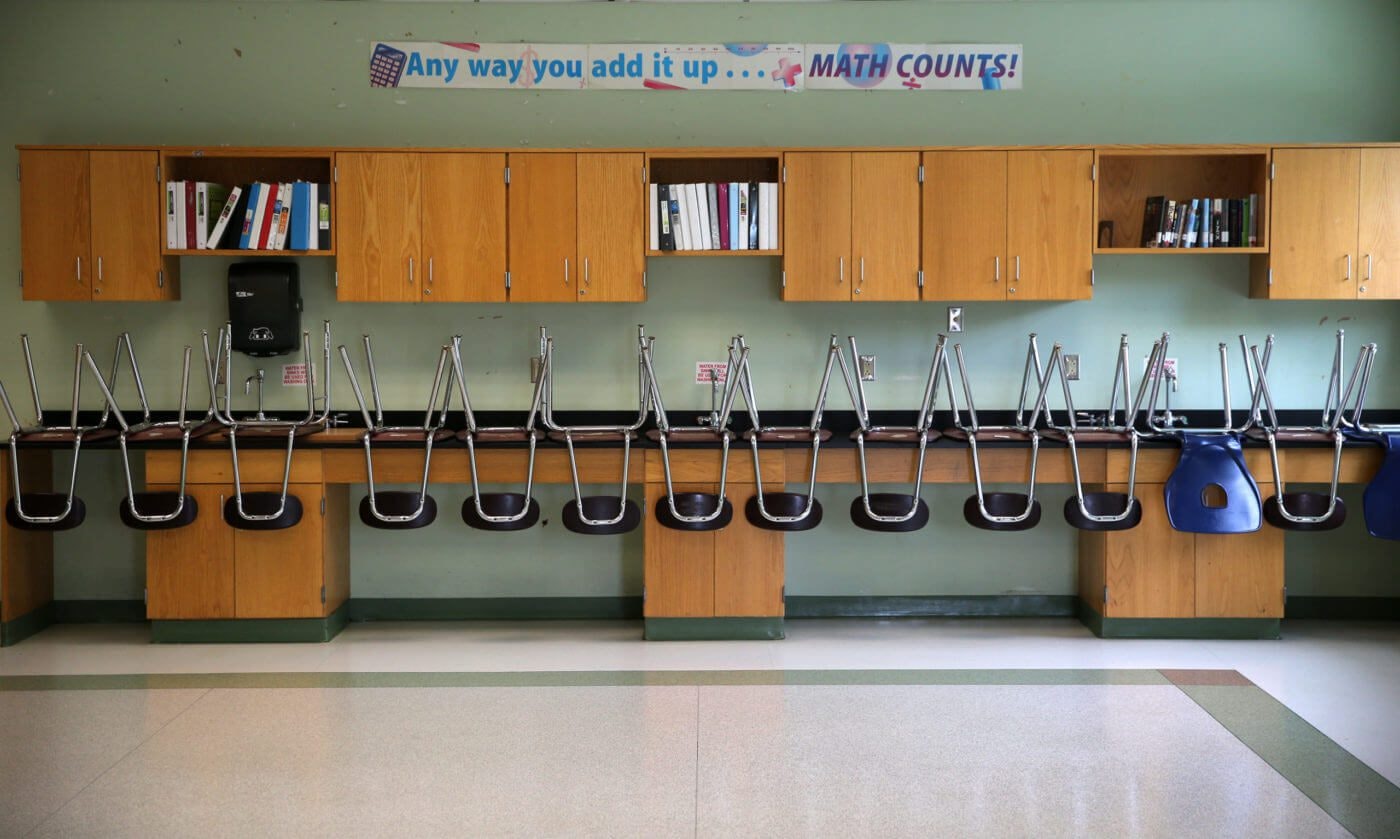 A finished clean room with stacked chairs in the science room at the Mildred Avenue K-8 School building in Boston's Mattapan, which were being cleaned for the reopening of school on July 9, 2020. Photo by David L. Ryan/The Boston Globe via Getty Images)