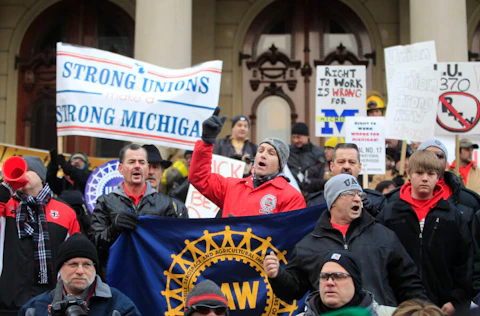 In this Dec. 11, 2012 file photo some of the thousands that gathered for a rally protest against the passage of right-to-work legislation outside the State Capitol in Lansing, Mich. (AP Photo/Carlos Osorio, File)