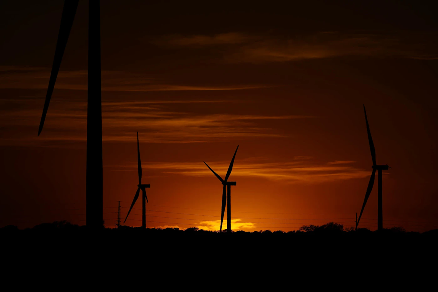 FILE - Wind turbines work at sunset on a wind farm near Del Rio, Texas, Wednesday, Feb. 15, 2023. The U.S. Department of Agriculture announced a nearly $11 billion investment on Tuesday, May 16, to help bring affordable clean energy to rural communities throughout the country. (AP Photo/Eric Gay, File)