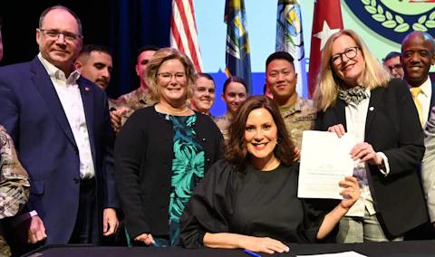 Gov. Gretchen Whitmer signs legislation to expand tuition assistance for spouses and children of Michigan National Guard members.