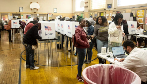 Voters check in at a polling station to cast their ballots in Detroit during the midterm elections. (Photo by Matthew Hatcher/SOPA Images/LightRocket via Getty Images)