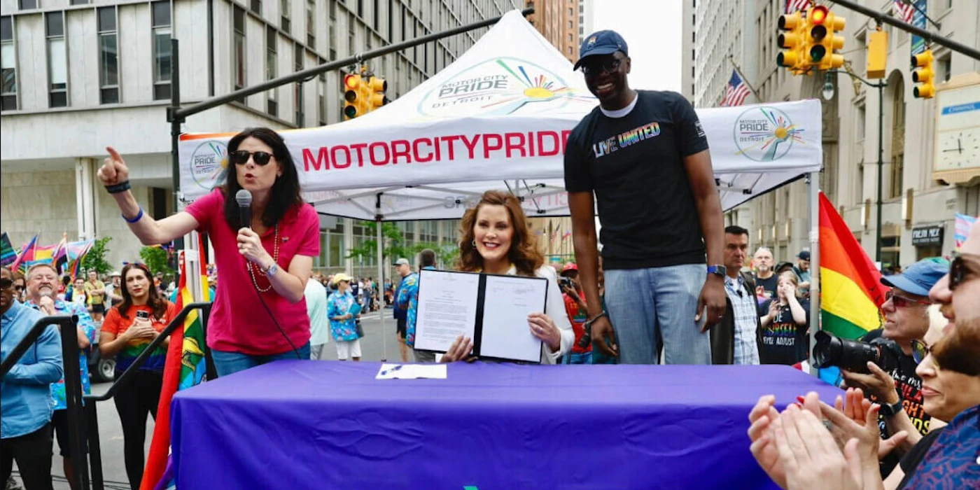 Gov. Gretchen Whitmer signs an executive order to form the state's first LGBTQ+ Commission alongside Attorney General Dana Nessel and Lt. Gov. Garlin Gilchrist.