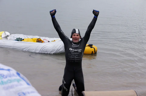 Jim Dreyer, a long-distance swimmer, arrives at Belle Isle in Detroit, Aug. 7, 2013. Dreyer, who swam across Lake Michigan in 1998, said he's returning 25 years later for a longer splash. Dreyer will attempt to swim at least 82.5 miles (133 kilometers), without getting out of the water, from Milwaukee to Grand Haven, Michigan, beginning on Tuesday, Aug. 1, 2023. (AP Photo/Carlos Osorio, File)