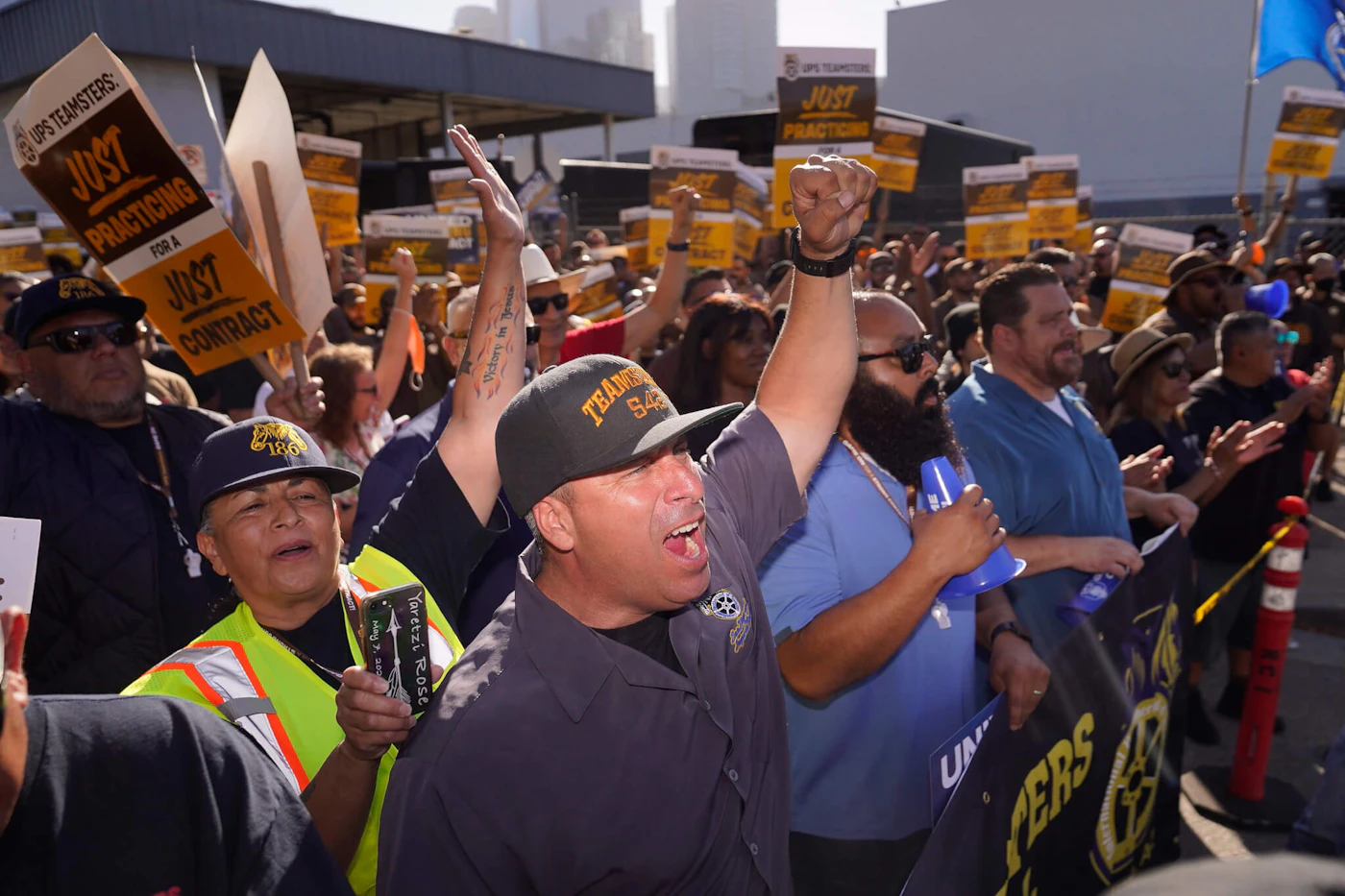 UPS teamsters and workers hold a rally in downtown Los Angeles, as a national strike deadline nears on Wednesday, July 19, 2023. A little more than a week after contract talks between United Parcel Service and the union representing 340,000 of its workers broke down, UPS said it will begin training nonunion employees in the U.S. to step in should there be a strike, which the union has vowed to do if no agreement is reached by the end of this month. (AP Photo/Damian Dovarganes)
