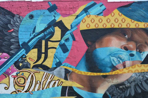 A Detroit North End mural of the noted Hip-hop producer J Dilla. (Photo via Ken Coleman, Michigan Advance)