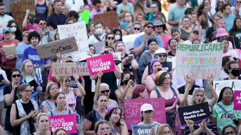 FILE - Abortion rights protesters attend a rally outside the state Capitol in Lansing, Mich., on June 24, 2022, following the United States Supreme Court's decision to overturn Roe v. Wade. Judge Elizabeth Gleicher, of the Court of Claims, on Wednesday, Sept. 7, 2022, struck down Michigan's 1931 anti-abortion law, months after suspending it. Judge Gleicher said the law, long dormant before U.S. Supreme Court overturned Roe v. Wade in June, violates the Michigan Constitution. (AP Photo/Paul Sancya, File)