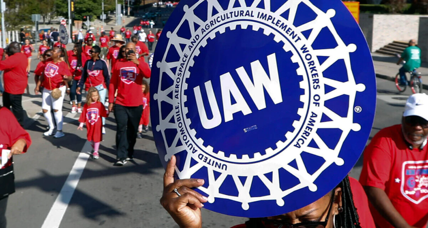 United Auto Workers members walk in the Labor Day parade in Detroit, Sept. 2, 2019. (AP Photo/Paul Sancya, File)