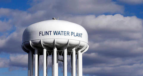 In this March 21, 2016, file photo, the Flint Water Plant water tower is seen in Flint. (AP Photo/Carlos Osorio, File)